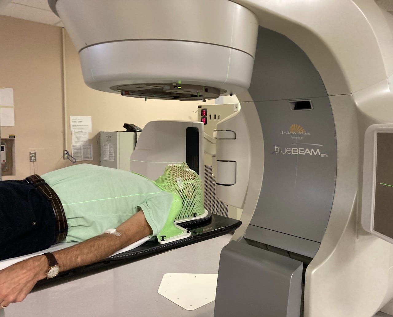 A man undergoing targeted radiation treatment for throat cancer